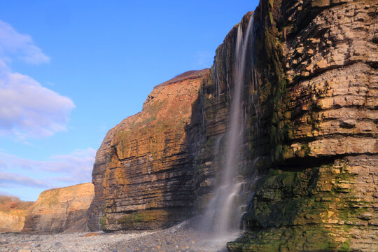Waterfall at Cwm Bach, Traeth Bach Beach, near Southerndown, Glamorgan Heritage Coast, South Wales