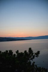 sunrise over the sea, clear sky without clouds. golden hour.	
