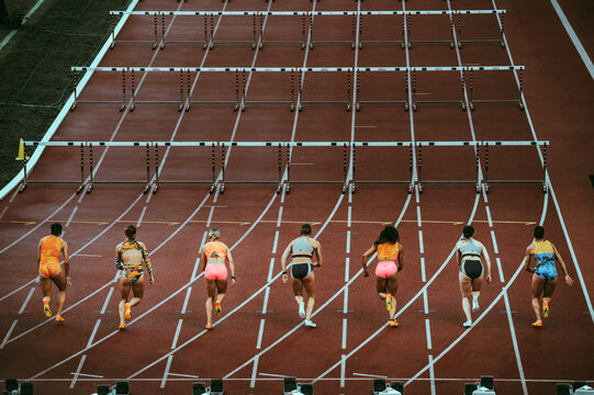 Start of 100 m hurdles race. Dynamic sport photo. Professional athletics event before world championship and Summer Game in Paris 2024. Professional Female Athletes in action