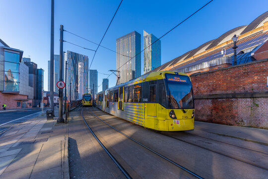 View of apartment buildings, city tram and Tower Of Light, Manchester, Lancashire, England