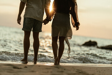 Enjoying Sunset On The Beach