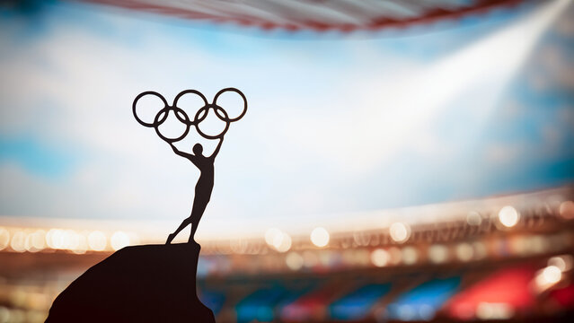 PARIS, FRANCE, JULY 7, 2023: Iconic Gesture: Statue of Athletics Woman Triumphantly Lifts Olympic Circle at Modern Olympic Stadium. Commemorating Paris 2024 Summer Olympics.
