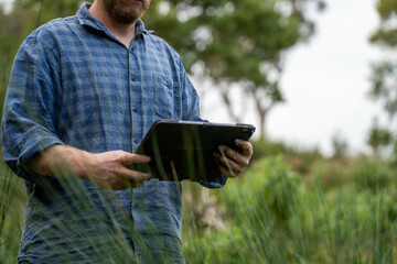 farmer hold soil in hands monitoring soil health on a farm.in australia