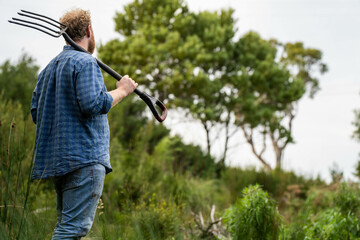 farmer holding soil looking at soil carbon in the america