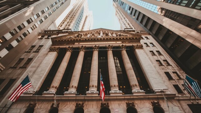 Iconic New York Stock Exchange building in the bustling city of New York, showcasing fine architectural detail and surrounded by busy streets.