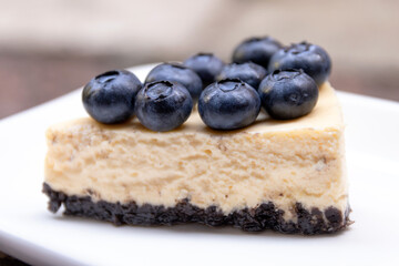 New York cheesecake with fresh blueberries on top.