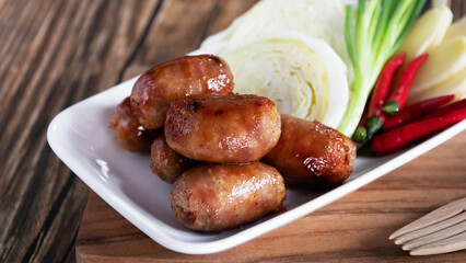 Pork sausages are a popular street food in Thailand. They're made with ground pork, garlic, and spices and grilled to perfection.