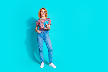 Full size photo of pretty woman use smart phone empty space wear t-shirt isolated on teal color background