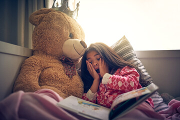 Reading book, wow and girl with teddy bear in bedroom of home for morning storytelling surprise....