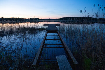 Fototapeta premium View of the lake shore at sunset