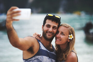 Happy couple, selfie and hug on beach for memory, date or holiday in relationship as partner....