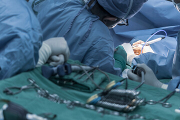 Close-up of a doctor performing heart surgery on a patient in the operating room. Portrait doctor...
