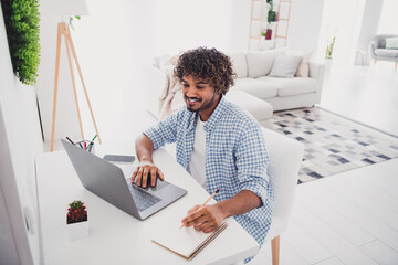 Photo of cool good mood man wear checkered shirt online education modern gadget indoors house...