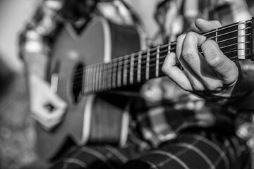 Music lifestyle man playing guitar nature concept. Hands of man musician playing guitar. Music...