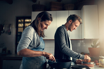 Family, mother and son with cooking in kitchen for bonding, support or helping with vegetables for...