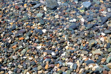 pebbles on the beach. Pebble beach background.