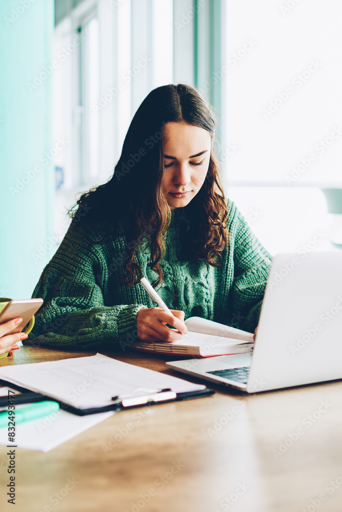 Poster smart student with friend preparing for training seminar writing plan in notebook and searching info