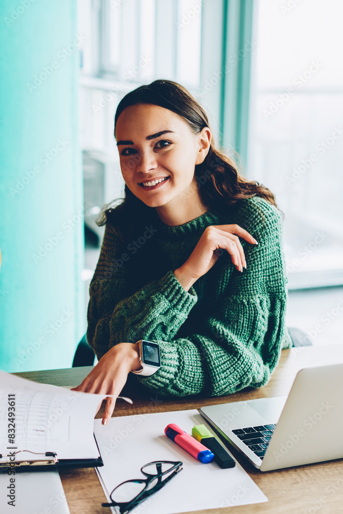 Poster portrait of successful female designers smiling at camera while working together on creating plan fo