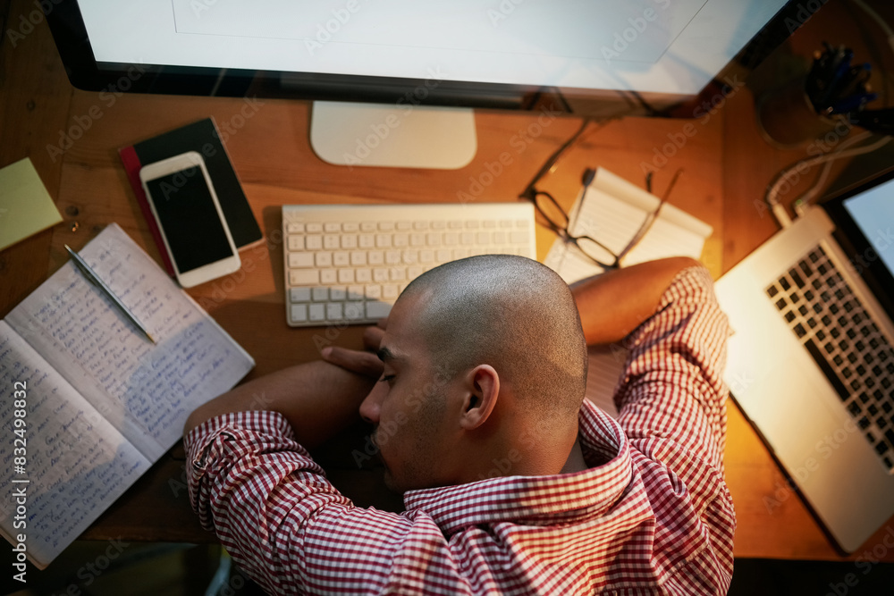 Poster Sleeping, employee and man on table, night and notes for research for web designer and tired in office. Workplace, above and person working late, burnout and notebook with computer on desk in startup