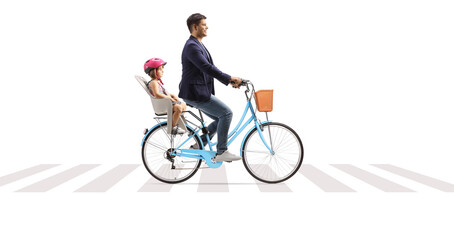 Father riding a bicycle with a kid in a child seat at a pedestrian crossing