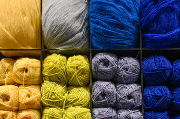 Colorful balls of wool on a store shelf