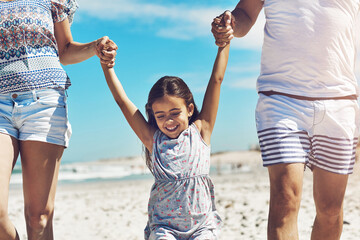 Family, parents and girl child on beach with love for holiday, vacation and development together on...