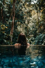 Fototapeta premium Relaxation young man unwinding in the pool of a luxurious resort, enjoying leisure time