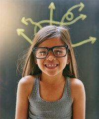 Girl, child and studio with glasses in portrait and happiness, attention or proud for youth. Female...