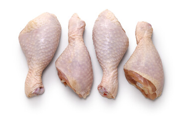 raw chicken drumsticks isolated on a white background
