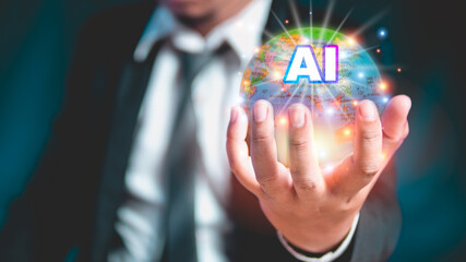 Businessman holds a AI globe. Connecting and using artificial intelligence technology with humans. Businessman concept and modern technology.