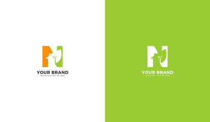 Natural leaf house N letter logo. Letter n, house, leaf design. Graphic vector illustration