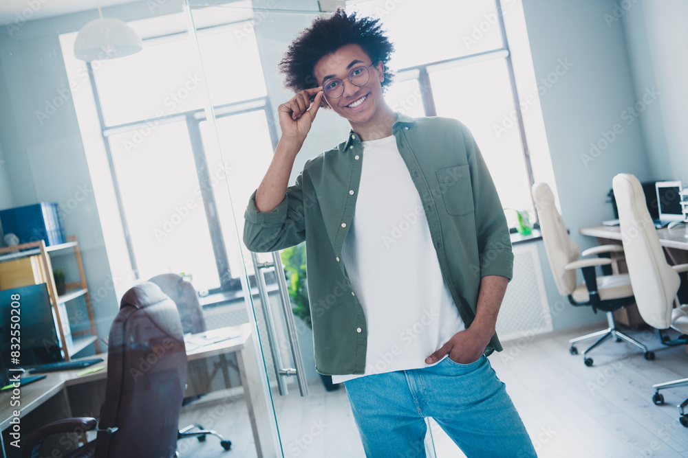 Sticker Photo of cheerful handsome agent dressed khaki shirt arm hand eyewear smiling indoors workshop workstation