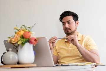 Young student with stress trying to resolve a problem in his laptop