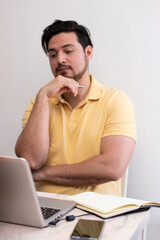 Young student with stress trying to resolve a problem in his laptop