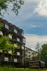 The old houses in the background of a modern high-rise apartment complex. High quality photo