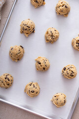 Scoops of cookie dough on baking sheet