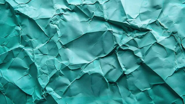 Background of a texture of a crumpled paper leaf in motion. Blank space for text. Seamless loop.