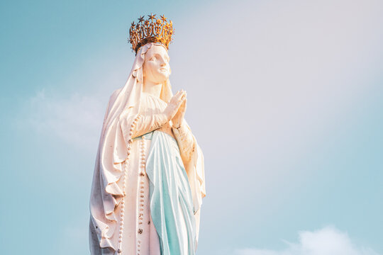 Sculpture of the crowned Virgin Mary in the Sanctuary of Lourdes in France