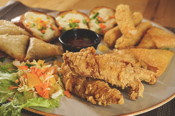 fried chicken mozzarella stick and bread  