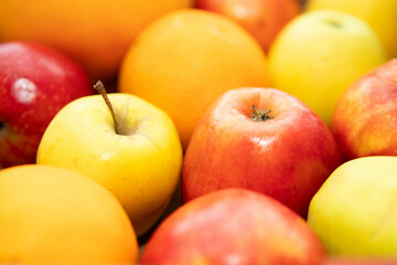 Apples and oranges background, photo of sweet and tasty fruits