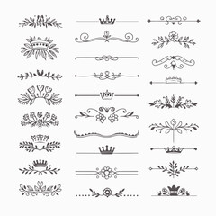 A collection of ornate design elements, primarily in the form of decorative dividers or borders. These designs are symmetrical and feature a mix of floral and crown motifs. They are positioned horizon