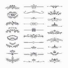 A collection of ornate design elements, primarily in the form of decorative dividers or borders. These designs are symmetrical and feature a mix of floral and crown motifs. They are positioned horizon