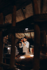 Man tasting fresh beer in a brewery