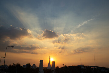 orange blue skyscape background with cloud and city town building in evening of the day sunset twilight dusk time