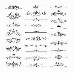 A collection of ornate design elements, primarily in the form of decorative dividers or borders. These designs are symmetrical and feature a mix of floral and crown motifs. They are positioned horizon