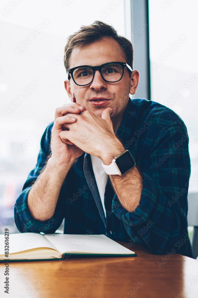 Poster half length portrait of young handsome clever student in cool eyewear pondering about coursework pro