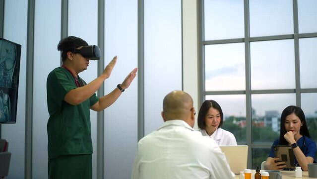 Doctor using virtual reality headset for training on medical purpose management with x ray film background, medical staff meeting discussion of medicine for healthcare using technology in office.
