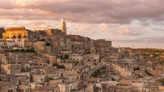 sassi di matera old town timelapse day to night zoom out,italian travel destination,picturesque historic city,time lapse at sunset