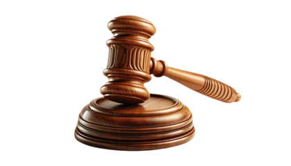 A wooden judge's gavel resting on a sound block on a transparent background. The gavel is intricately carved with a polished finish