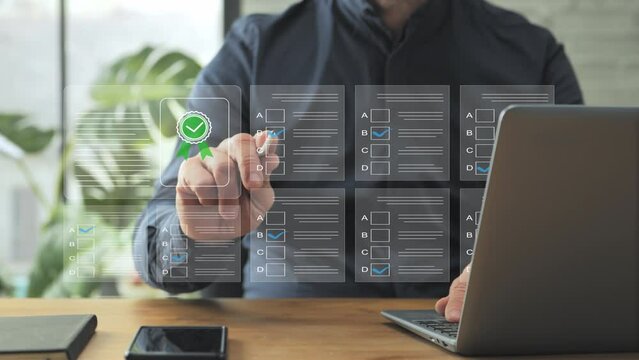 online assessment test man at laptop computer gets certification,male sits at the desk at home fills questionnaire checklist,answers questions,business quality certificate evaluation